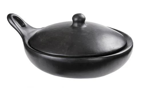 Black ceramic tureen with lid on a white background