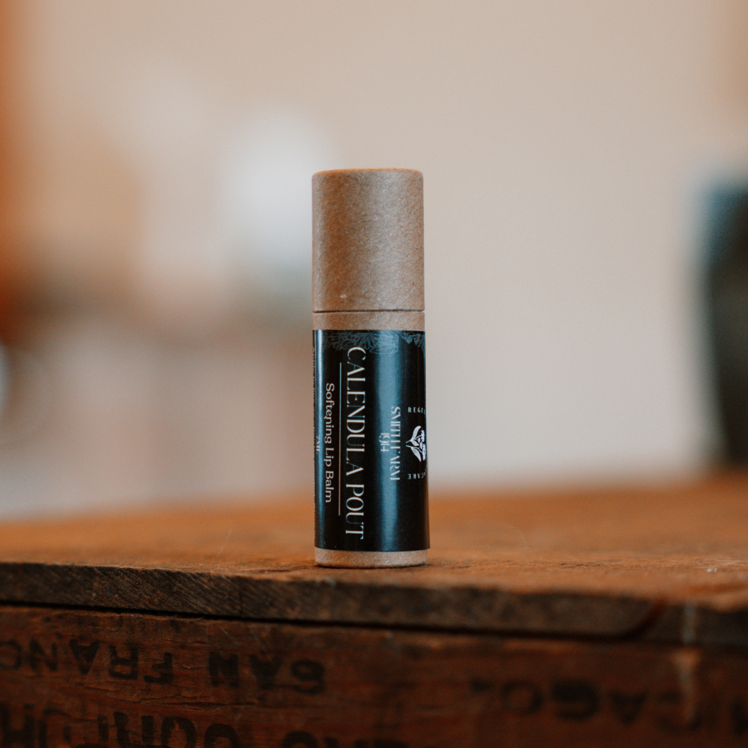 Small cylindrical container on a wooden surface with a blurred background
