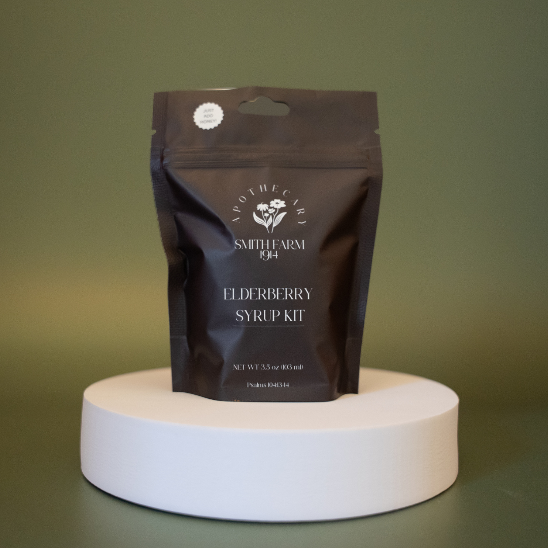 Smith Farm Elderberry Syrup Kit packaging on a white stand with a green background